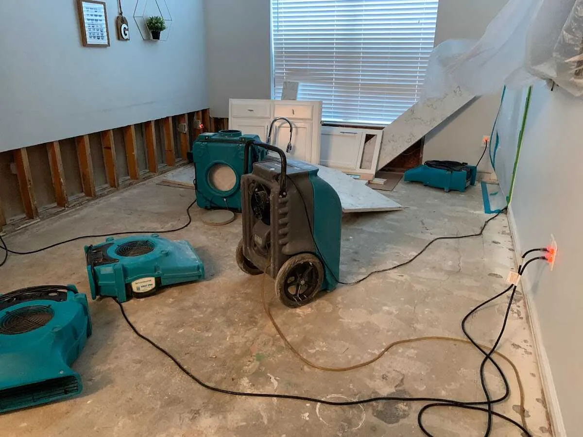 Dehumidifier in flood-cut room for Water Damage Restoration in Johnson Lane